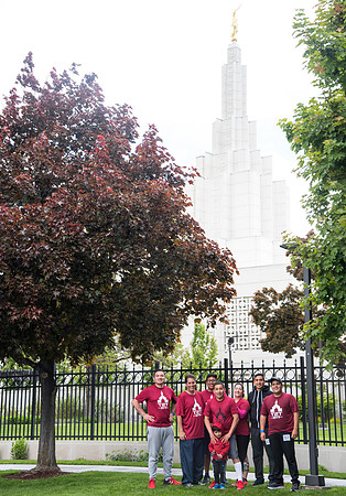 After braving the unpredictable Idaho weather in June, teams celebrate crossing the finish line near the Idaho Falls Temple in the annual temple to temple relay race.