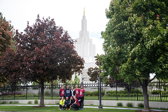 After braving the unpredictable Idaho weather in June, teams celebrate crossing the finish line near the Idaho Falls Temple in the annual temple to temple relay race.