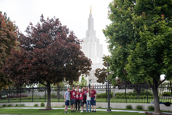 After braving the unpredictable Idaho weather in June, teams celebrate crossing the finish line near the Idaho Falls Temple in the annual temple to temple relay race.