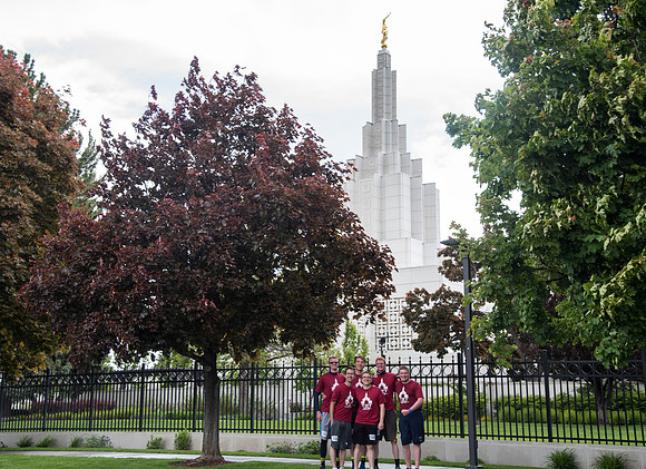 After braving the unpredictable Idaho weather in June, teams celebrate crossing the finish line near the Idaho Falls Temple in the annual temple to temple relay race.