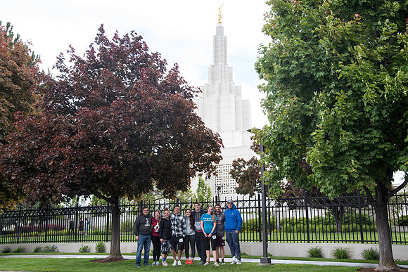 After braving the unpredictable Idaho weather in June, teams celebrate crossing the finish line near the Idaho Falls Temple in the annual temple to temple relay race.