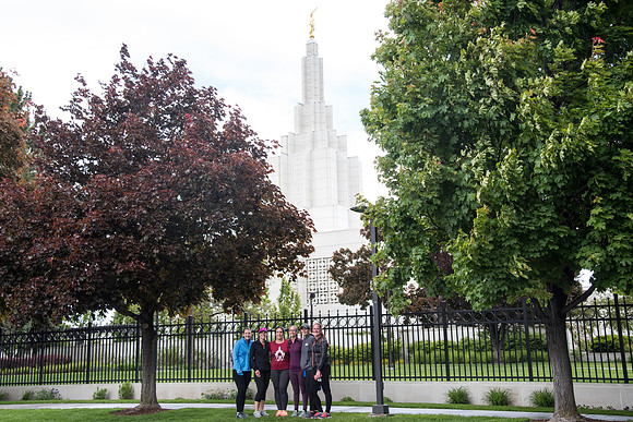 After braving the unpredictable Idaho weather in June, teams celebrate crossing the finish line near the Idaho Falls Temple in the annual temple to temple relay race.