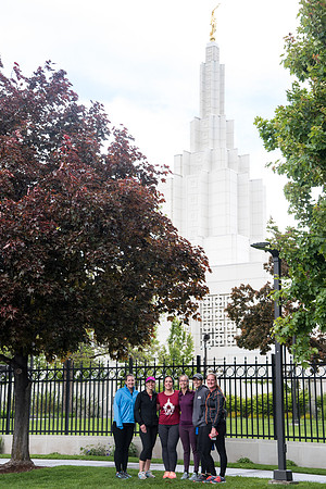 After braving the unpredictable Idaho weather in June, teams celebrate crossing the finish line near the Idaho Falls Temple in the annual temple to temple relay race.