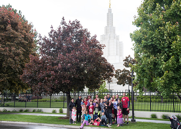 After braving the unpredictable Idaho weather in June, teams celebrate crossing the finish line near the Idaho Falls Temple in the annual temple to temple relay race.