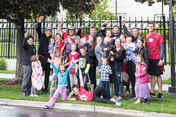 After braving the unpredictable Idaho weather in June, teams celebrate crossing the finish line near the Idaho Falls Temple in the annual temple to temple relay race.