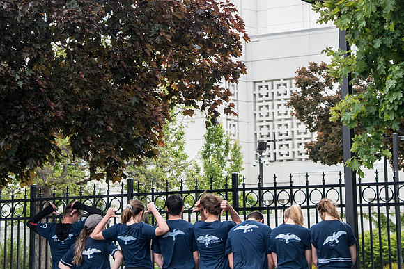 After braving the unpredictable Idaho weather in June, teams celebrate crossing the finish line near the Idaho Falls Temple in the annual temple to temple relay race.