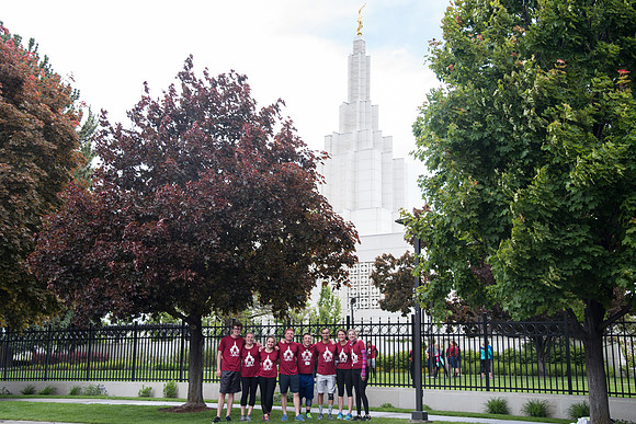 After braving the unpredictable Idaho weather in June, teams celebrate crossing the finish line near the Idaho Falls Temple in the annual temple to temple relay race.