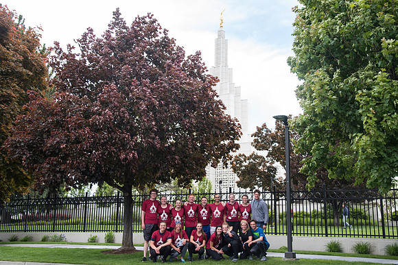 After braving the unpredictable Idaho weather in June, teams celebrate crossing the finish line near the Idaho Falls Temple in the annual temple to temple relay race.