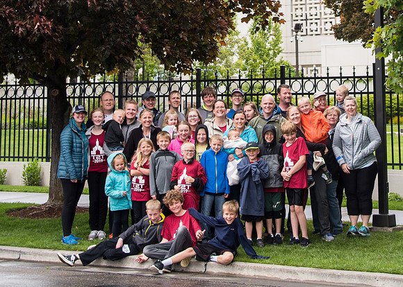 After braving the unpredictable Idaho weather in June, teams celebrate crossing the finish line near the Idaho Falls Temple in the annual temple to temple relay race.