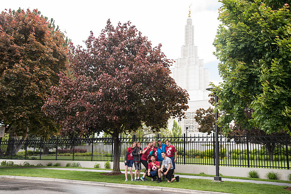 After braving the unpredictable Idaho weather in June, teams celebrate crossing the finish line near the Idaho Falls Temple in the annual temple to temple relay race.