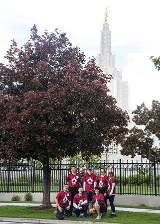 After braving the unpredictable Idaho weather in June, teams celebrate crossing the finish line near the Idaho Falls Temple in the annual temple to temple relay race.