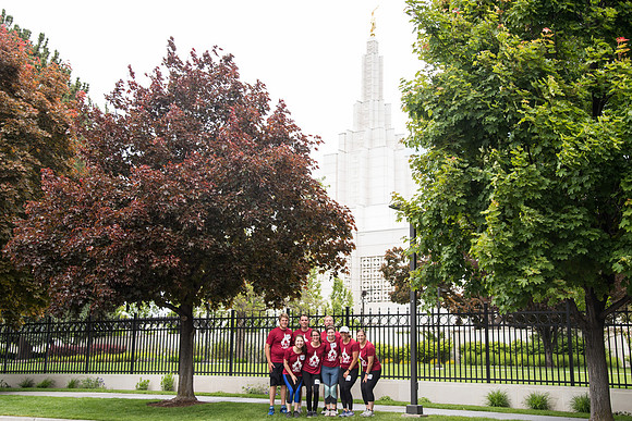 After braving the unpredictable Idaho weather in June, teams celebrate crossing the finish line near the Idaho Falls Temple in the annual temple to temple relay race.