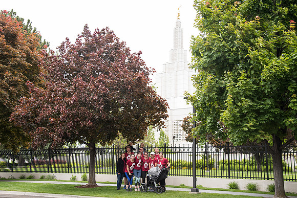 After braving the unpredictable Idaho weather in June, teams celebrate crossing the finish line near the Idaho Falls Temple in the annual temple to temple relay race.