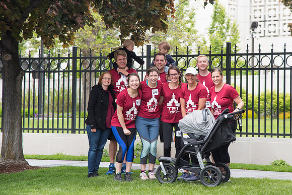 After braving the unpredictable Idaho weather in June, teams celebrate crossing the finish line near the Idaho Falls Temple in the annual temple to temple relay race.