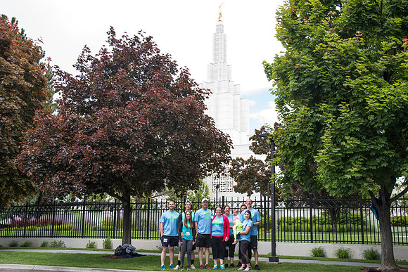 After braving the unpredictable Idaho weather in June, teams celebrate crossing the finish line near the Idaho Falls Temple in the annual temple to temple relay race.