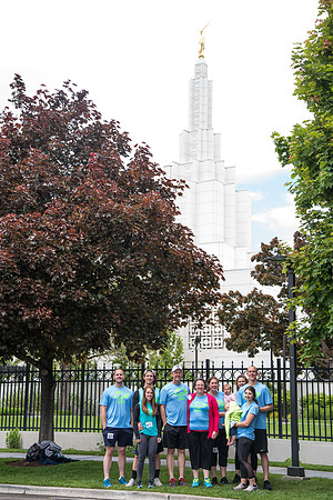 After braving the unpredictable Idaho weather in June, teams celebrate crossing the finish line near the Idaho Falls Temple in the annual temple to temple relay race.