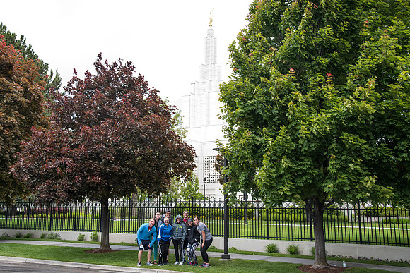 After braving the unpredictable Idaho weather in June, teams celebrate crossing the finish line near the Idaho Falls Temple in the annual temple to temple relay race.