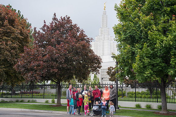 After braving the unpredictable Idaho weather in June, teams celebrate crossing the finish line near the Idaho Falls Temple in the annual temple to temple relay race.