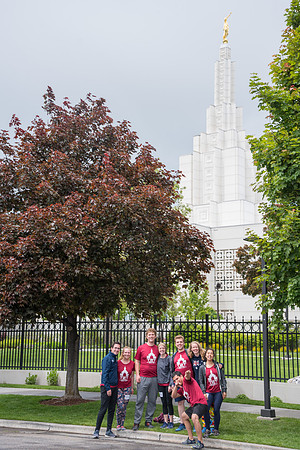 After braving the unpredictable Idaho weather in June, teams celebrate crossing the finish line near the Idaho Falls Temple in the annual temple to temple relay race.