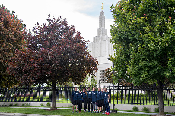 After braving the unpredictable Idaho weather in June, teams celebrate crossing the finish line near the Idaho Falls Temple in the annual temple to temple relay race.