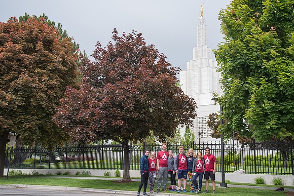After braving the unpredictable Idaho weather in June, teams celebrate crossing the finish line near the Idaho Falls Temple in the annual temple to temple relay race.