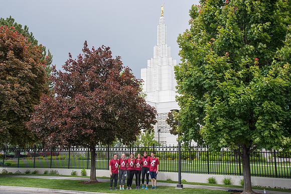 After braving the unpredictable Idaho weather in June, teams celebrate crossing the finish line near the Idaho Falls Temple in the annual temple to temple relay race.