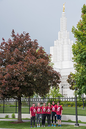 After braving the unpredictable Idaho weather in June, teams celebrate crossing the finish line near the Idaho Falls Temple in the annual temple to temple relay race.