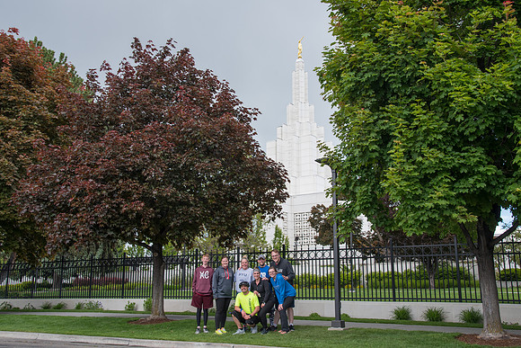 After braving the unpredictable Idaho weather in June, teams celebrate crossing the finish line near the Idaho Falls Temple in the annual temple to temple relay race.