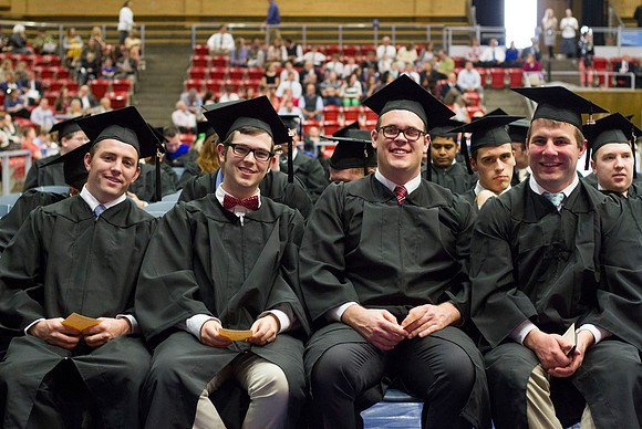 Graduates eagerly smile before Convocation begins in the Hart Auditorium during the 2014 Winter Semester Graduation at BYU-Idaho. Photo by Tyler Rickenbach