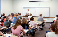 Religion Department faculty, Randy Hayes teaching in a classroom.
