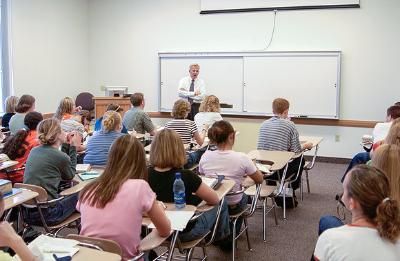 Religion Department faculty, Randy Hayes teaching in a classroom.