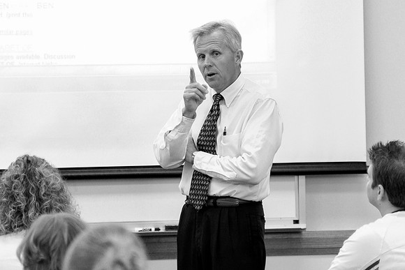 Religion Department faculty, Randy Hayes teaching in a classroom.