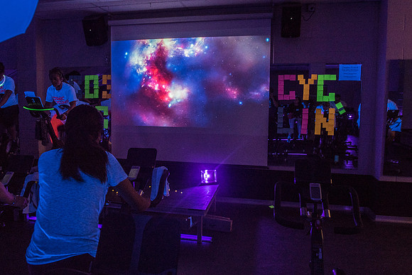 Cosmic Cycling - June 2019 - Black lights, glowsticks, Electronic Dance Music, and indoor cycling all come together for a night of fun. Held in Dance Studio 141 in the Hart building, Spring Semester.