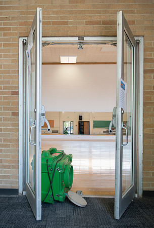 Fans are placed throughout buildings to dry floors.
