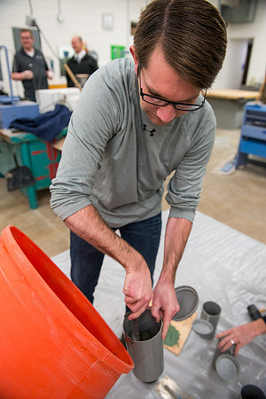Civil engineering students work with different mixtures of cement to make a light, yet durable, cement that will be the building material for a canoe.