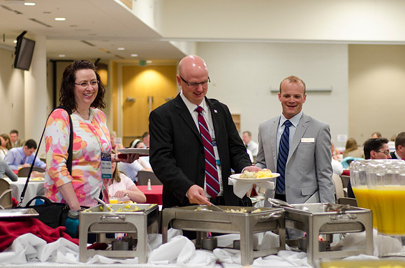 Online instructors gather for breakfast and instruction.