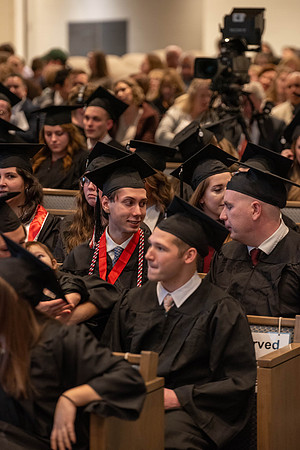 Students graduate from the College of Language and Letters. Jason Williams hands out the awards.