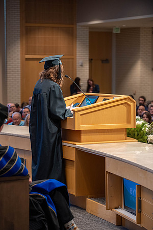 Students graduate from the College of Language and Letters. Jason Williams hands out the awards.