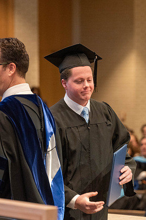 Students graduate from the College of Language and Letters. Jason Williams hands out the awards.