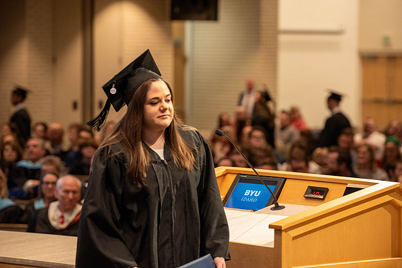 Students graduate from the College of Language and Letters. Jason Williams hands out the awards.