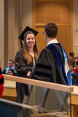 Students graduate from the College of Language and Letters. Jason Williams hands out the awards.