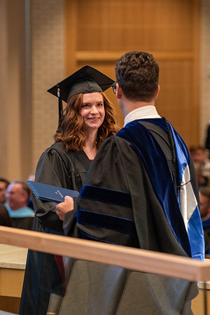 Students graduate from the College of Language and Letters. Jason Williams hands out the awards.