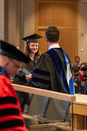 Students graduate from the College of Language and Letters. Jason Williams hands out the awards.