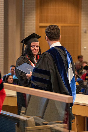 Students graduate from the College of Language and Letters. Jason Williams hands out the awards.
