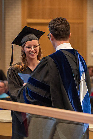 Students graduate from the College of Language and Letters. Jason Williams hands out the awards.