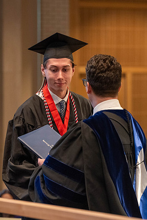 Students graduate from the College of Language and Letters. Jason Williams hands out the awards.