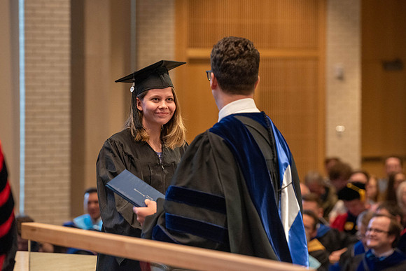 Students graduate from the College of Language and Letters. Jason Williams hands out the awards.