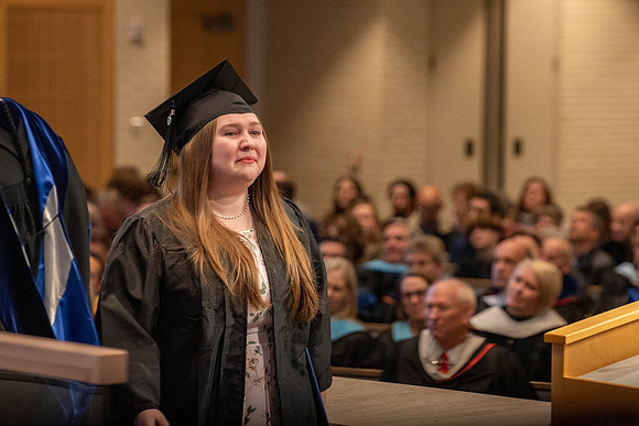 Students graduate from the College of Language and Letters. Jason Williams hands out the awards.