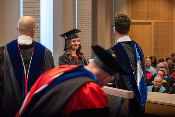 Students graduate from the College of Language and Letters. Jason Williams hands out the awards.