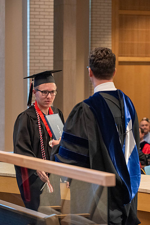 Students graduate from the College of Language and Letters. Jason Williams hands out the awards.